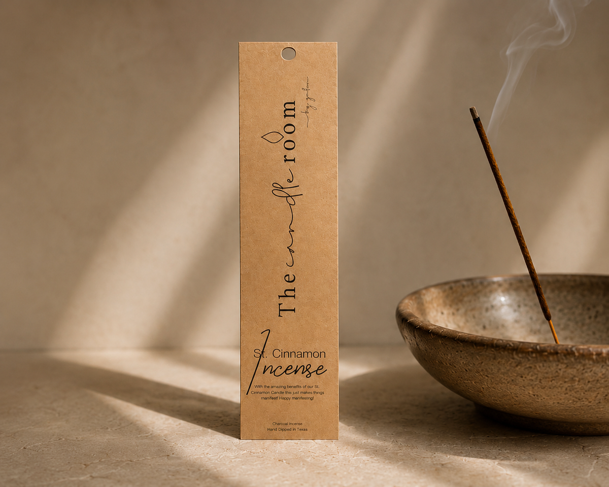 St. Cinnamon charcoal incense in kraft paper packaging, stick burning in a ceramic bowl