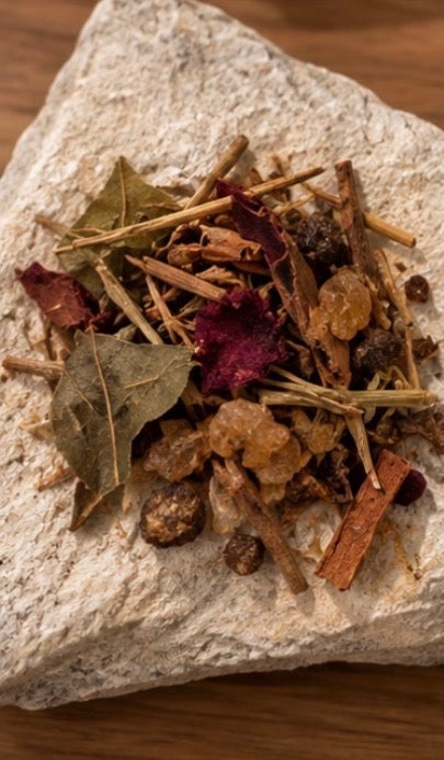 The Offering incense blend, overhead on stone