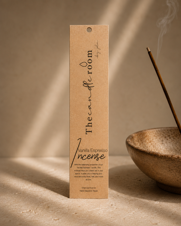 Vanilla Espresso charcoal incense in kraft paper packaging with a lit stick in a ceramic bowl